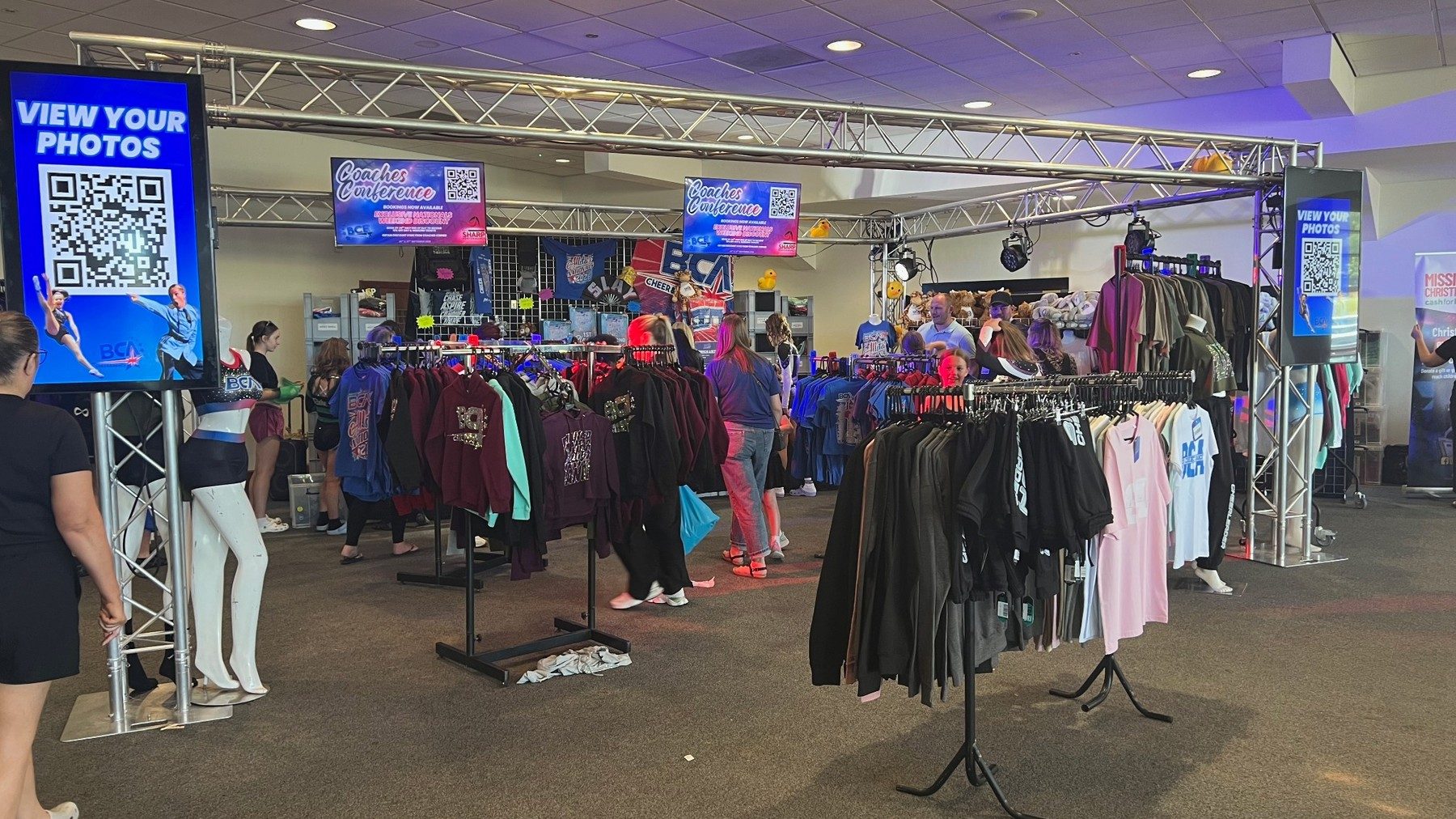 Temporary retail installation with digital signage and customer activity